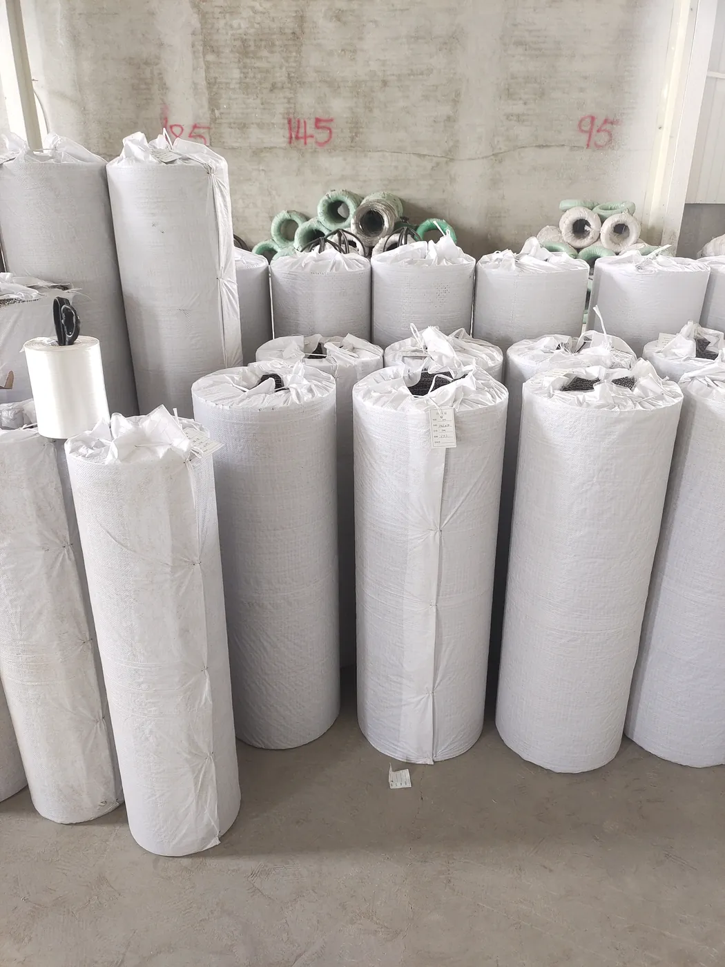 Finished crimped wire mesh rolls and panels packed for export shipment