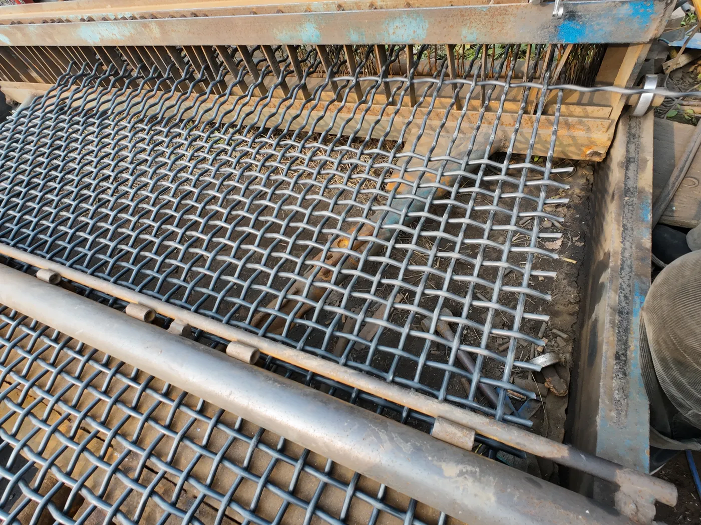 Crimped wire mesh weaving production line at Anping Hand in Hand factory in Hebei China