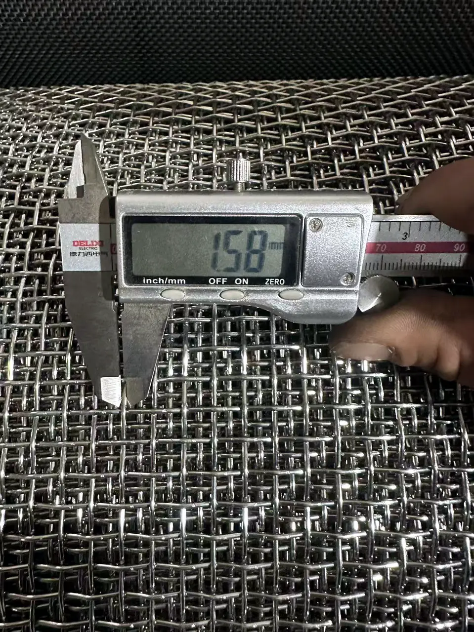 Stainless steel wire tension and feed checkpoint controlling pre-crimped weave consistency on Anping Hand in Hand crimped mesh weaving line