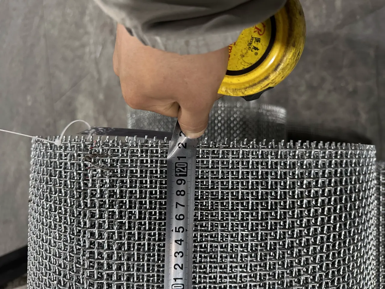 Finished stainless steel crimped wire mesh rolls stacked in Anping Hand in Hand warehouse ready for FOB Tianjin Xingang export to Australia, Europe, and North America