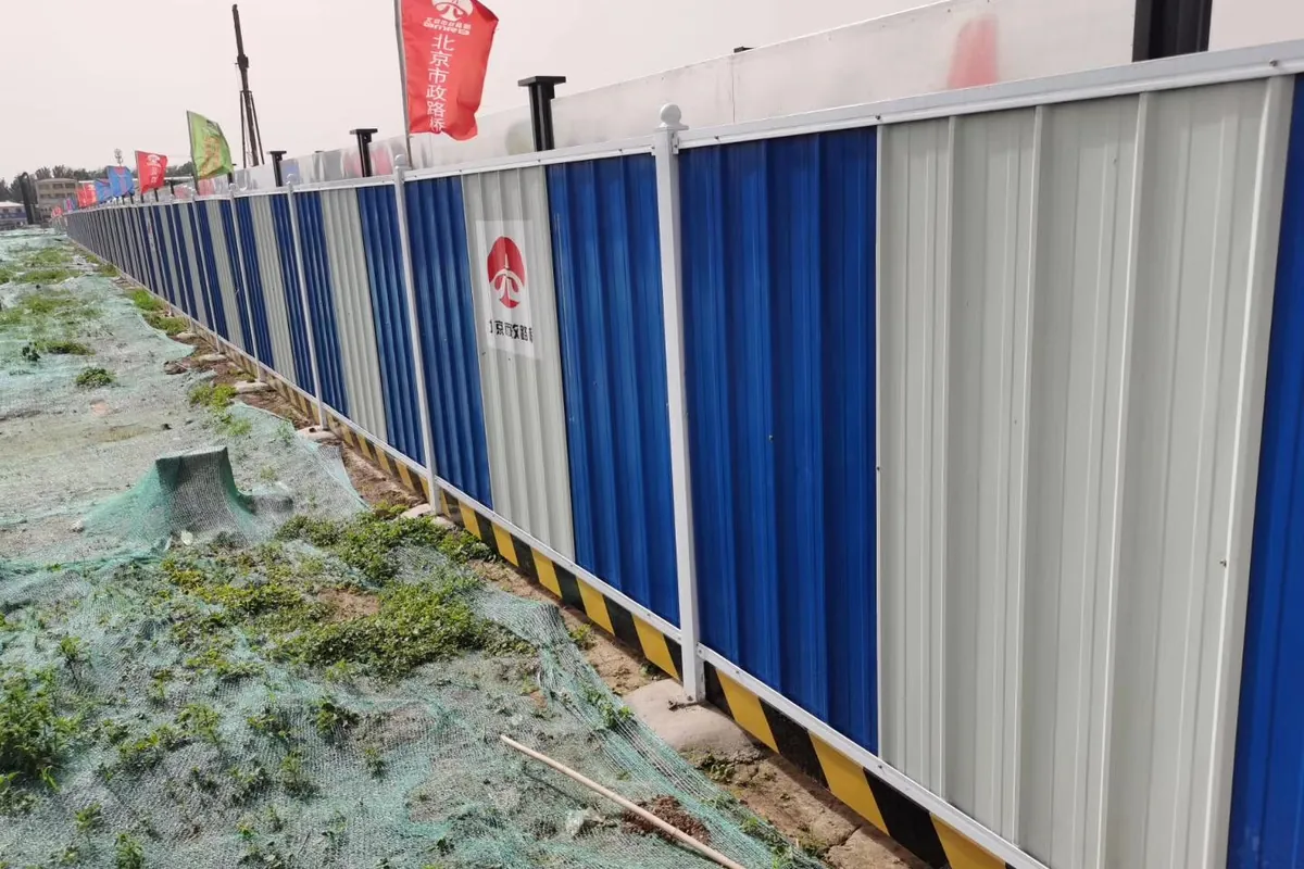 Galvanized steel plate site hoarding around an urban construction project