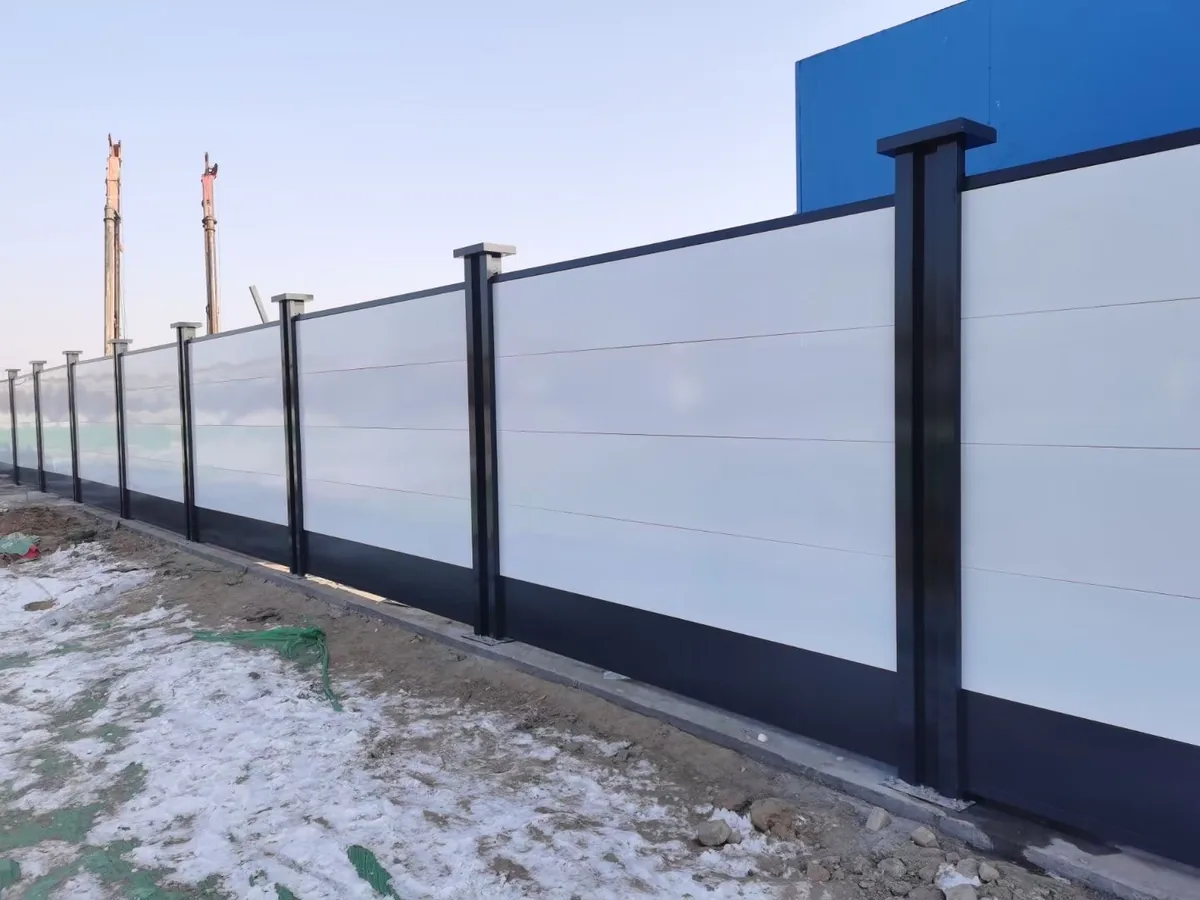 Temporary welded mesh fence panels installed around an active construction site