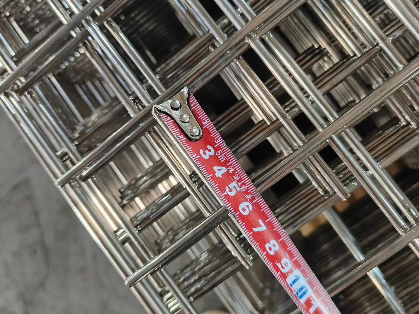 Stainless steel wire mesh panel fabrication line at the Anping Hand in Hand factory production process