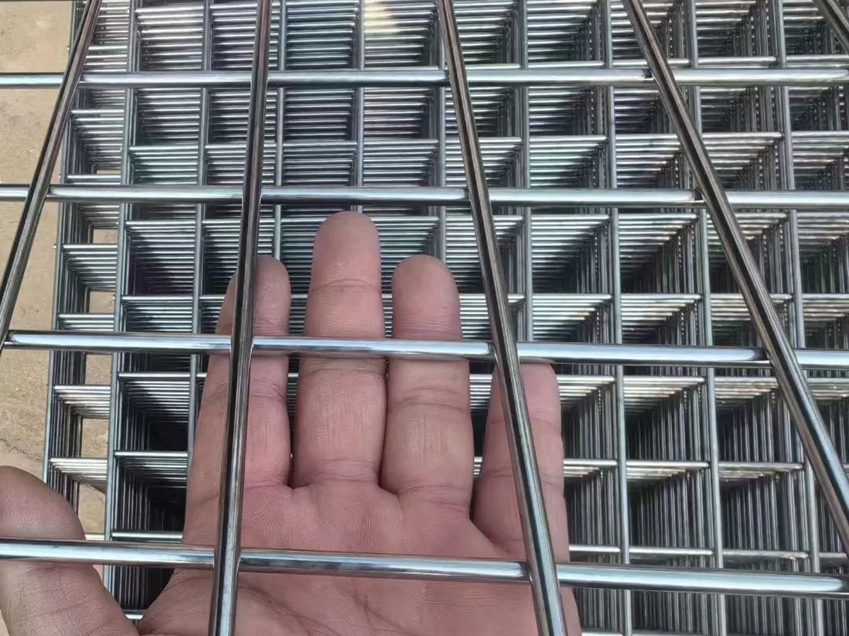 Close-up of stainless steel wire mesh panel showing opening size and weld point detail