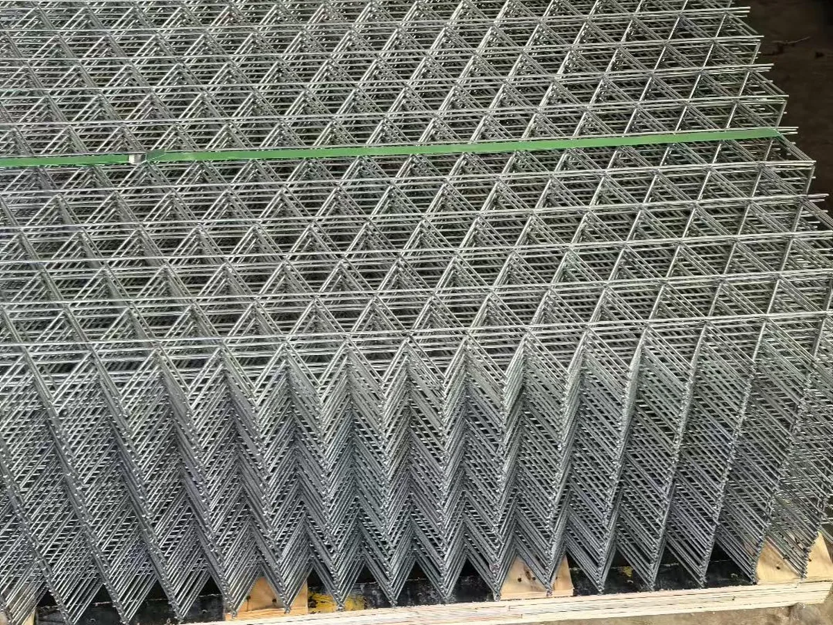 Stack of stainless steel wire mesh panels in workshop ready for inspection and packing