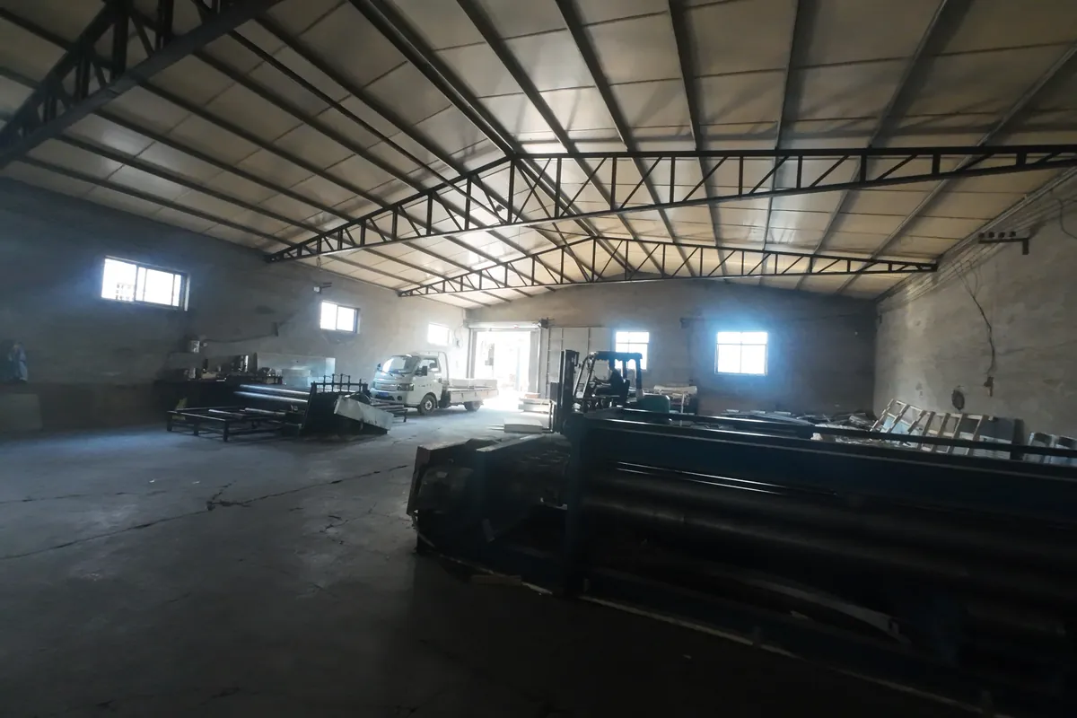 Anping Hand in Hand perforated metal factory yard at dusk operational 24-hour production capacity