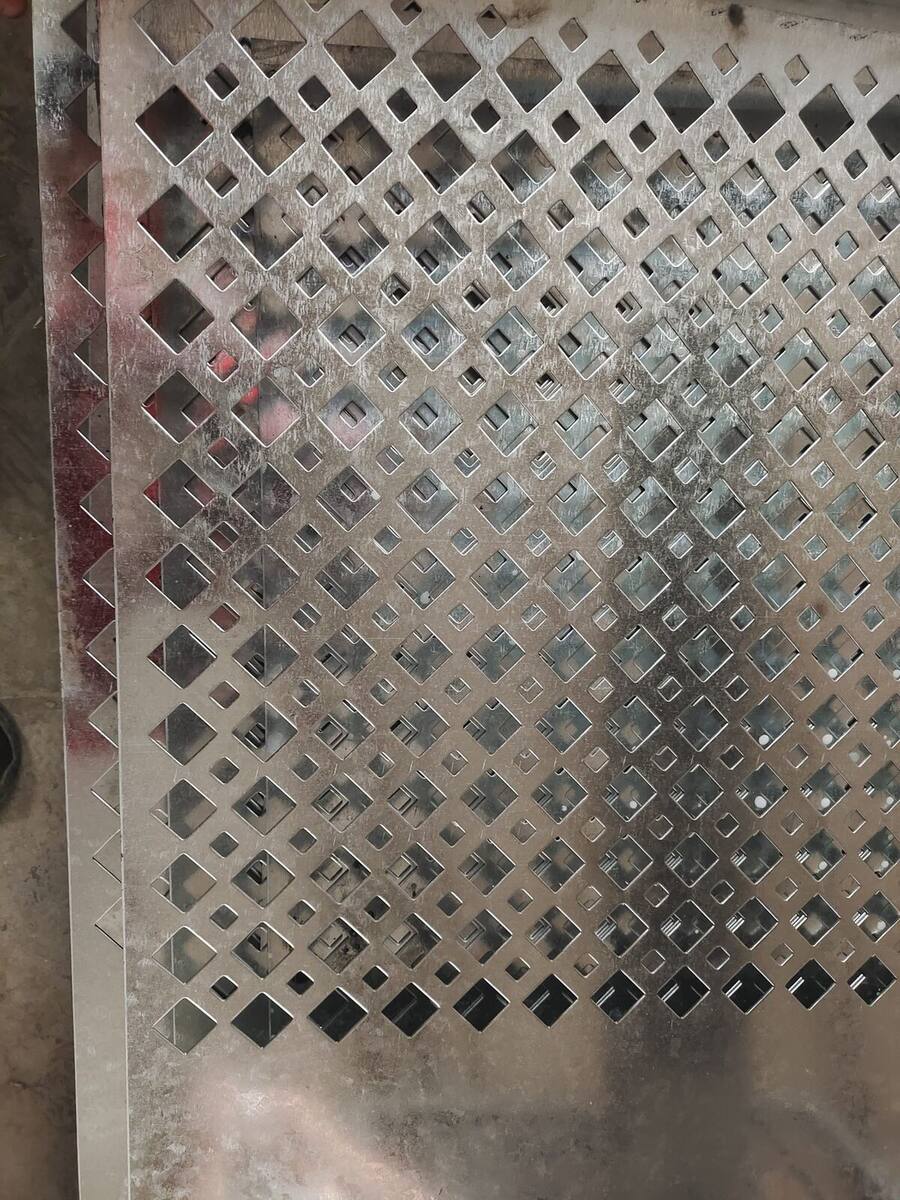 Perforated metal sheet with round holes for ventilation, filtration and machine guards