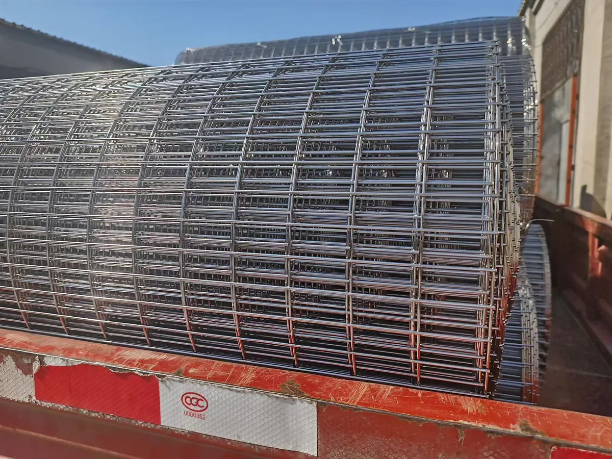 Stacked 304 and 316 stainless welded mesh sheets at Anping Hand in Hand factory finished goods stockyard