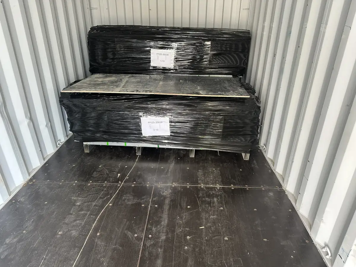 Anping Hand in Hand workshop — palletized and shrink-wrapped products secured inside container for overseas shipment